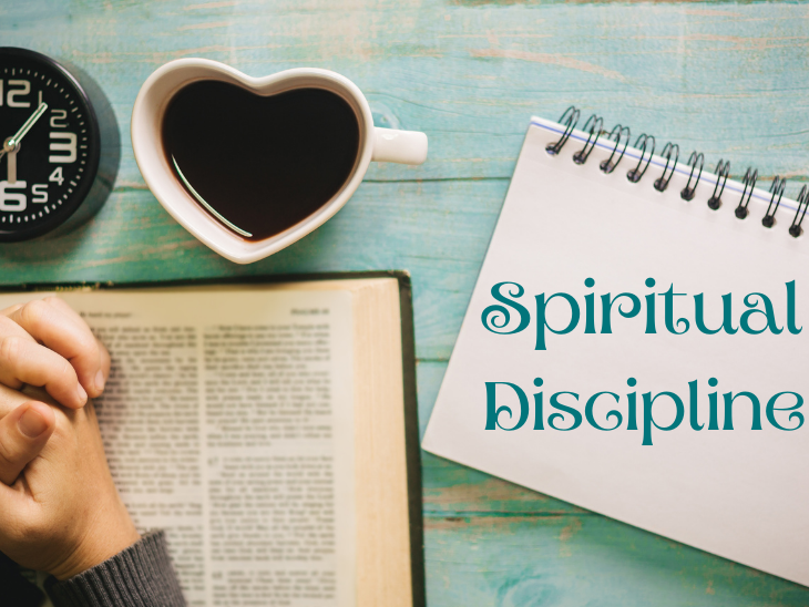 Spiritual Discipline shown by with sitting down praying and reading the Bible at a certain time everyday.